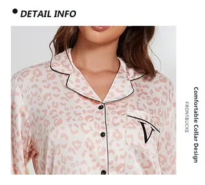 Detail of lapel neckline on pink leopard print silk pajamas with black piping and buttons