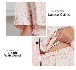 Detail of pink leopard satin pajamas showing loose cuffs and an elastic waistband