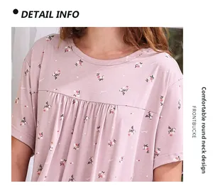 Detail view of the round neck and floral pattern on this soft pink cotton nightdress