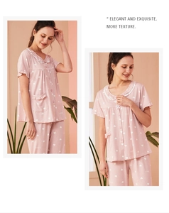 Pink cotton pajama set with short sleeves, heart pattern, and lace collar detail