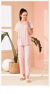 Pink short sleeve pajamas with white heart prints and Peter Pan collar detail