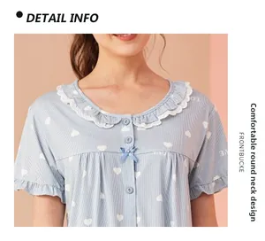 Detail of light blue heart print pajama top with lace round neck and silk bow detail