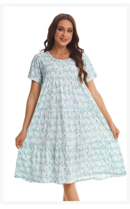 Detail of multi-layered tiered hem on a white short-sleeved floral cotton nightgown