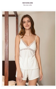 Detail view of white modal sleepwear set with delicate lace trim and ribbed texture