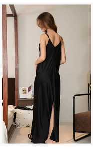 Close-up of the elegant back V-neck and split hem on this black satin slip nightdress