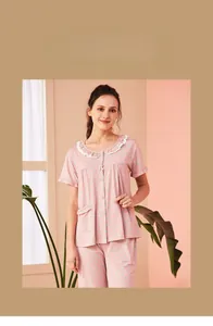 Pink plaid cotton pajamas set featuring delicate white lace trim and bow on the collar