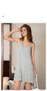Detail view of a soft grey sleeveless nightdress in a cozy home setting