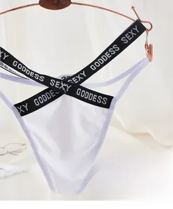 Detailed view of white ice silk thong with Sexy Goddess black crisscross waist straps