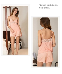 Detailed lace trim and V-neckline of this peach modal camisole and shorts pajama set