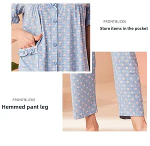 Detail view of cotton pajama pockets with ruffle trim and hemmed cuffs in blue plaid print