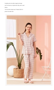 Detail view of pink plaid cotton pajamas with silky satin stitching for luxury comfort