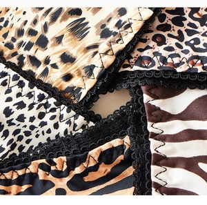 Détails du tissu élastique à imprimé léopard et zèbre avec bords élégants en dentelle noire