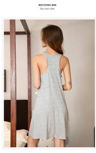 Rear view of a comfortable grey viscose stretch nightdress in a cozy bedroom setting