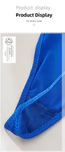Macro shot of breathable honeycomb mesh fabric and zig-zag stitching on blue lace thong