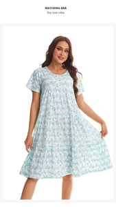 Detail view of light blue floral short sleeve cotton tiered dress with relaxed fit