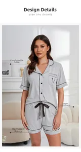 Detail of grey modal pajamas set with classic notched collar and black contrast piping