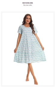 Detail of light blue floral cotton nightgown featuring a multi-layered tiered skirt design