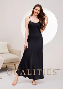 Elegant black silk satin slip dress with thin straps and a long flowing silhouette