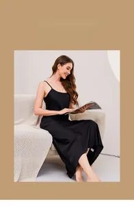 Elegant long black silk-like nightdress with thin straps and a minimalist lounge style