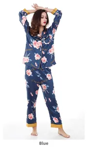 Detail of navy blue satin pajama set with rose floral prints and gold piped edges