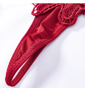 Macro shot showing detail of bright red lace and silk fabric on women's lingerie