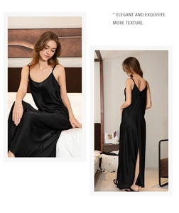 Detail of elegant black silk nightgown with side slit and smooth satin texture