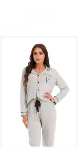 Detail view of light gray modal pajamas set with front pocket and button closure