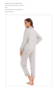 Detail view of women's gray pajama set with delicate black piping and ribbed texture