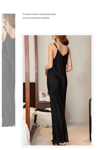 Detail of elegant black satin nightgown featuring slim straps and smooth glossy fabric