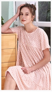 Close-up of pink floral nightdress fabric with high-waist pleats and soft texture
