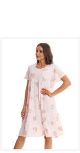 Detail of pink peach print nightdress featuring tiered ruffle hem and soft cotton fabric