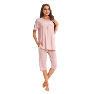 Pink polka dot cotton pajama set for women with short sleeve top and capri pants