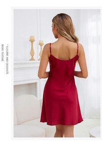 Detail of red satin chemise with adjustable straps and elegant backless design