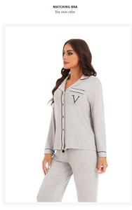 Detailed view of the embroidered V logo on the soft modal pajama pocket with black trim