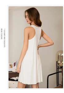 Close-up of white ribbed sleeveless nightgown featuring elegant racerback detail