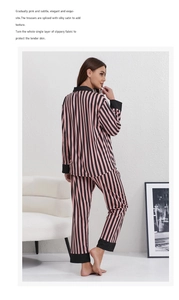 Detail of pink and black striped satin pajamas featuring contrast black sleeve cuffs