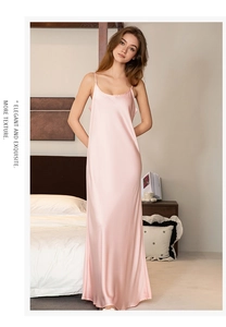 Detailed view of elegant pink satin nightgown with slim straps and side split