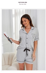 Detail view of grey modal pajamas with black contrast piping and drawstring waist