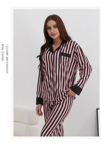 Detail view of pink and black striped long-sleeve pajama set with elegant lapel collar