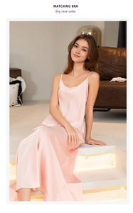 Elegant dry rose silk nightgown with thin straps and a side slit shown in a modern home