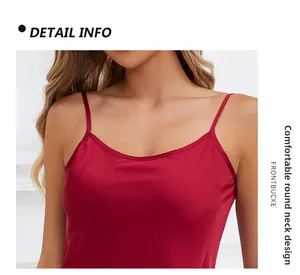Detail view of red satin camisole with thin straps and comfortable scoop neckline