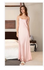 Detail of elegant light pink satin nightgown showing premium silky fabric and ankle length