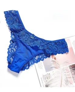 Detail of royal blue floral lace texture on sexy thong with elegant mesh design