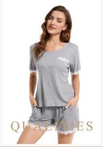 Detail of soft modal cotton pajama set with elegant lace trim on cuffs and pockets