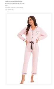 Detail of pink pajamas set with black piping, chest pocket and v-letter embroidery