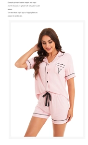 Detail of pink modal pajamas set with black piping contrast and embroidered pocket