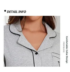 Detail of grey modal cotton pajama lapel collar with contrast piping and black buttons