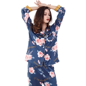 Women's dark blue satin pajama set with pink floral print and long sleeves