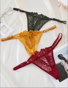 Three-piece set of lace thongs in green, yellow, and red with adjustable straps