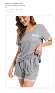 Detail of grey modal cotton pajama set showing white lace trim on sleeves and pocket